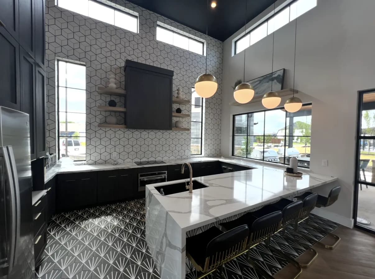 Calacatta-style quartz peninsula with waterfall edge